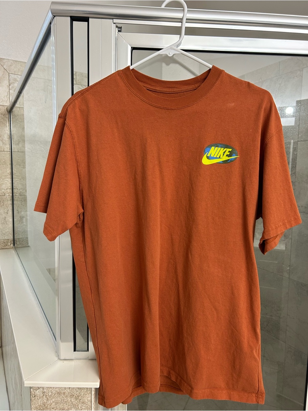 Nike Men's Rust Orange Tee with Yellow & Blue Logo